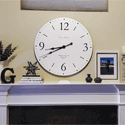 white sd series wall clock over a white fireplace